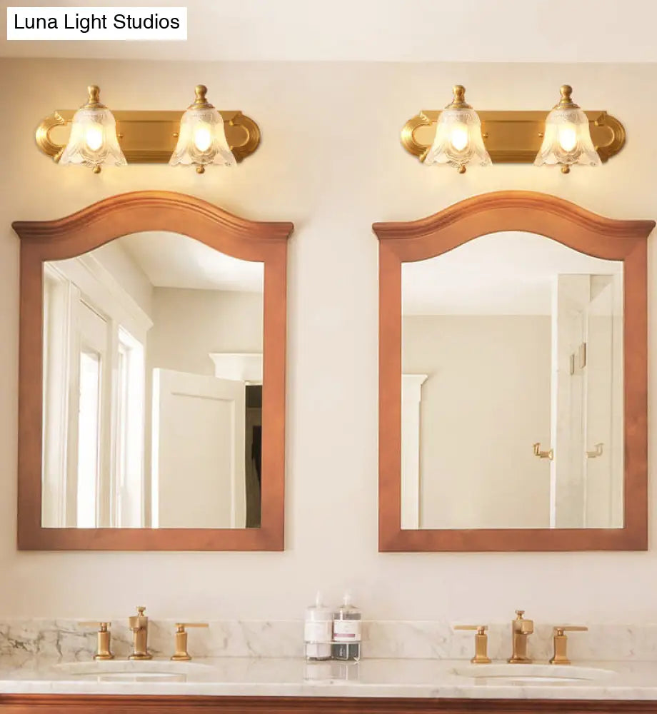 Brass Armed Wall Sconce With Ribbed Glass Shade For Bathroom Decoration