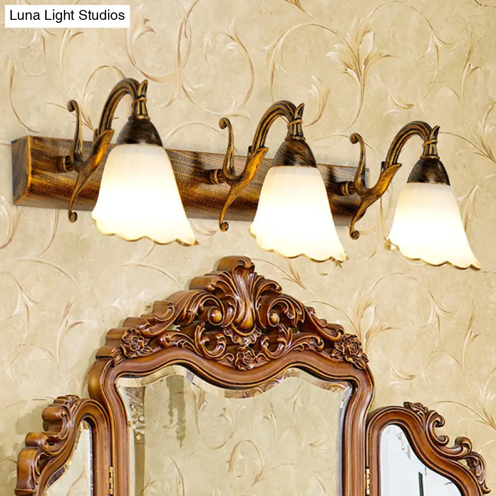 Bronze Wall Lamp With Country Flower Shade And White Rid Glass For Vanity Lighting
