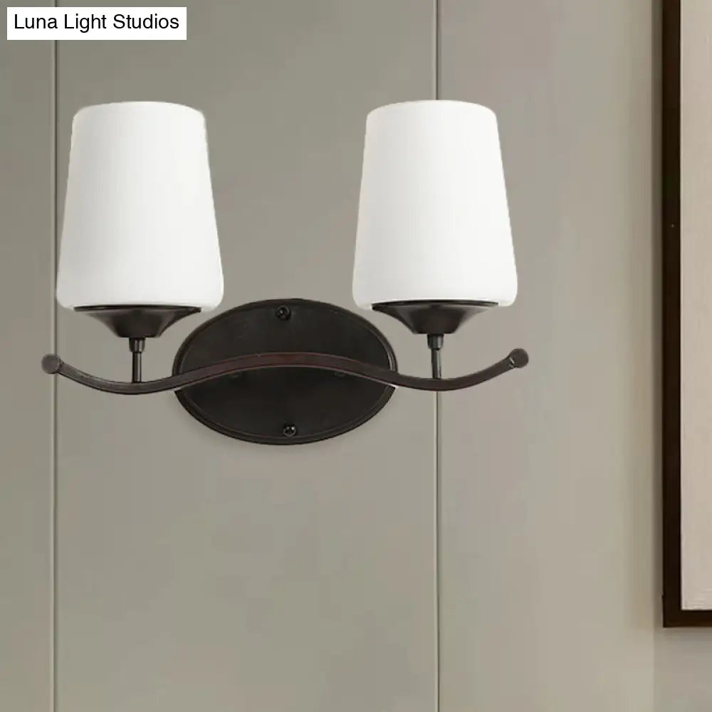 Ivory Glass Vanity Lighting With Iron Wavy Arm - Traditional Black Tapered Wall Light For Bedroom