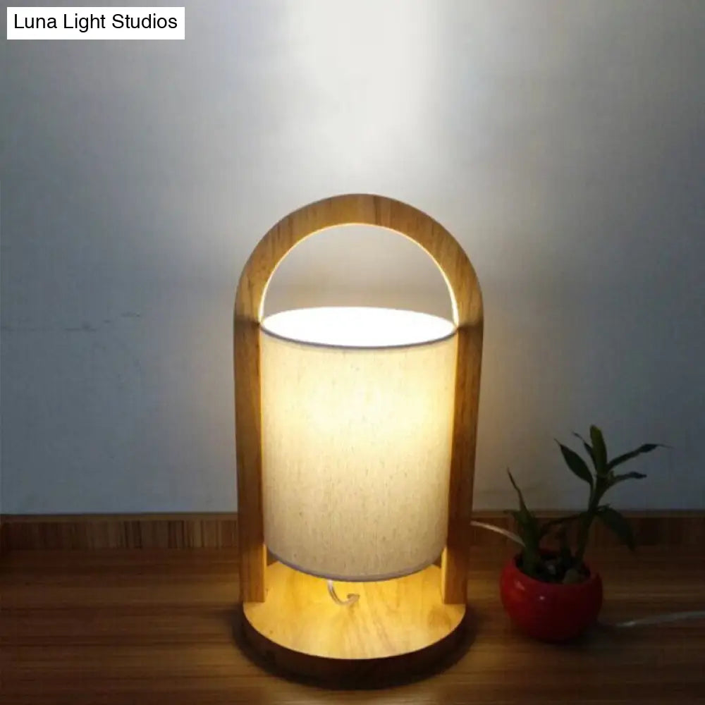 Modern White Cylindrical Nightstand Lamp With Wood Handle - Task Light Fabric Shade 1 Bulb