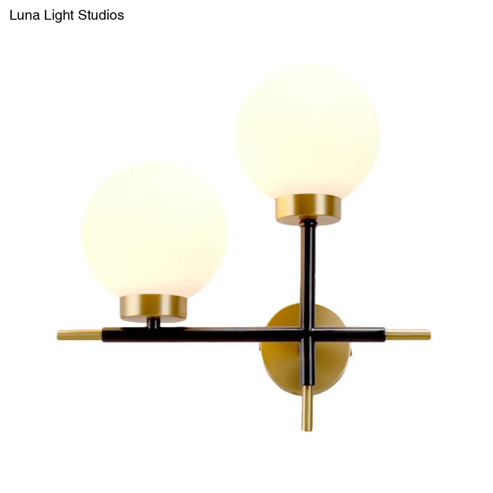Post-Modern White Glass Sphere Wall Sconce With Brass Finish - 1/2 Bulbs