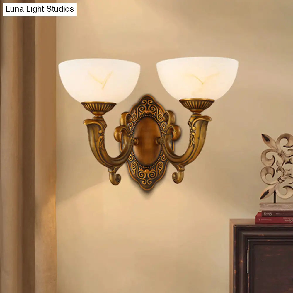 Rustic Brass Wall Sconce With Frosted Glass Shade - Swooping Arm Design For Ambient Lighting