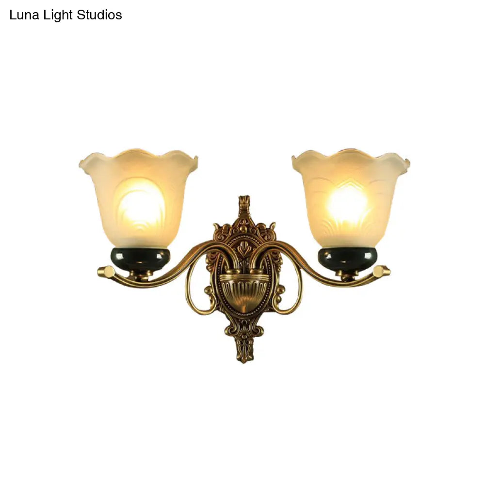 Traditional Brass Floral Wall Lamp With Frosted Glass And Carved Backplate