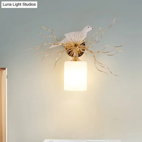 1-Head White Glass Wall Lamp For Bedroom - Loft Cylinder Lighting With Bird Accent