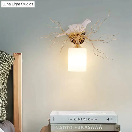 1-Head White Glass Wall Lamp For Bedroom - Loft Cylinder Lighting With Bird Accent