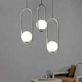 Sleek Chrome Oblong Pendant Light With Minimalist Design And Orb White Glass Shade