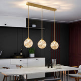 Sleek Brass Sphere Led Pendant Lamp For Modern Dining Rooms