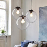 Sleek Clear Glass Pendant Light With A Touch Of Simplicity - Black Spherical Design Suspended