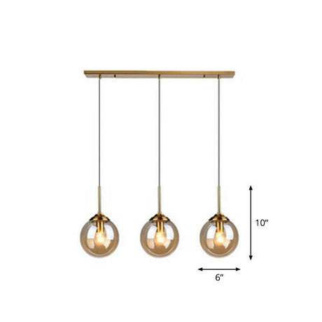 Sleek Glass 3-Bulb Spherical Ceiling Light Fixture In Brass For Minimalistic Dining Rooms