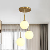 Modern White Glass Orb Hanging Ceiling Light With 3 Lights And Brass Finish