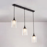 Minimalist Black Pendulum Lamp With 3-Light Clear Glass Cylinder And Linear/Round Canopy