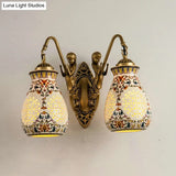 Antique Brass Ceramic Wall Sconce With Pierced Jar Traditional Patterned Design And Small Mermaid