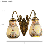 Antique Brass Ceramic Wall Sconce With Pierced Jar Traditional Patterned Design And Small Mermaid