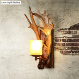 Antler Decor Wall Mount Light With Beige Glass Fixture In Brown - Traditional Cup Style