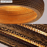 Asian Stylish Brown Corrugated Paper Pendant Lamp With Drum Shape And Globe Design - 1 Light Indoor