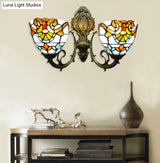 Baroque Stained Glass Wall Sconce With Curved Arm - Aged Brass Finish