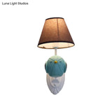 Bird Wall Mount Light Cartoon 1 Head Resin Sconce Lamp With Pink/Blue Color Cone Brown Fabric Shade