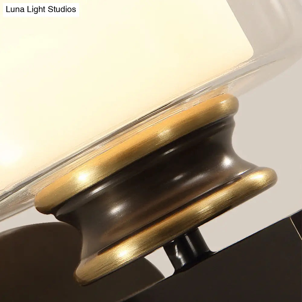 Black 1-Light Wall Sconce - Traditional Metal Cylinder With Double-Tier Glass Shade For Bedroom