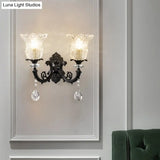 Black Flower Wall Lamp With Clear Crystal Glass Shade & Minimalist Design