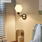 Black-Gold Geometric Sconce Light With Antique Ivory Glass For Bedroom