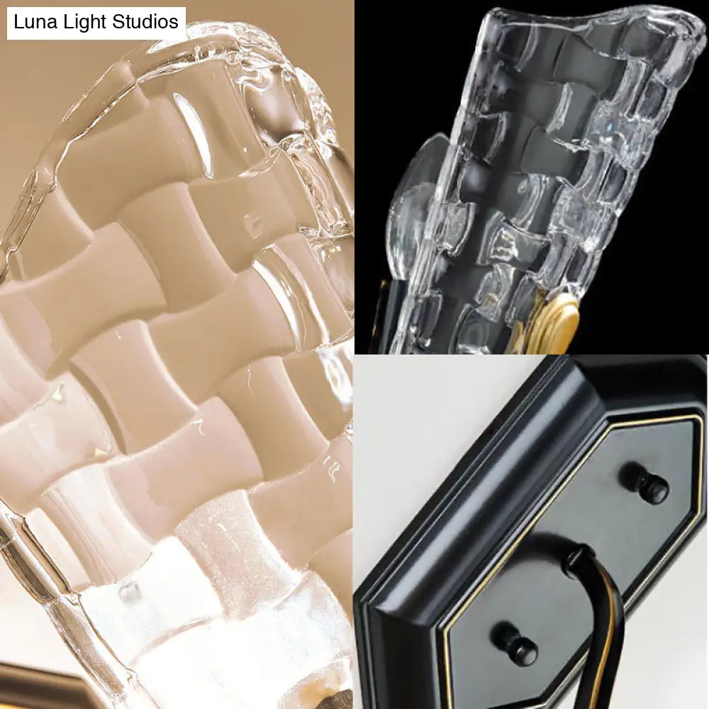 Black Modernist Wall Sconce With Curved Metal Arm And Clear Crystal Panel