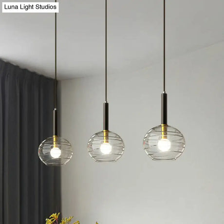 Black Textured Glass Dining Room Pendant With Modern Spherical Hanging Design