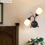 Black Tulip Wall Sconce With Ivory Glass And Crystal Accent