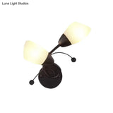 Black Tulip Wall Sconce With Ivory Glass And Crystal Accent