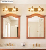 Brass Armed Wall Sconce With Ribbed Glass Shade For Bathroom Decoration