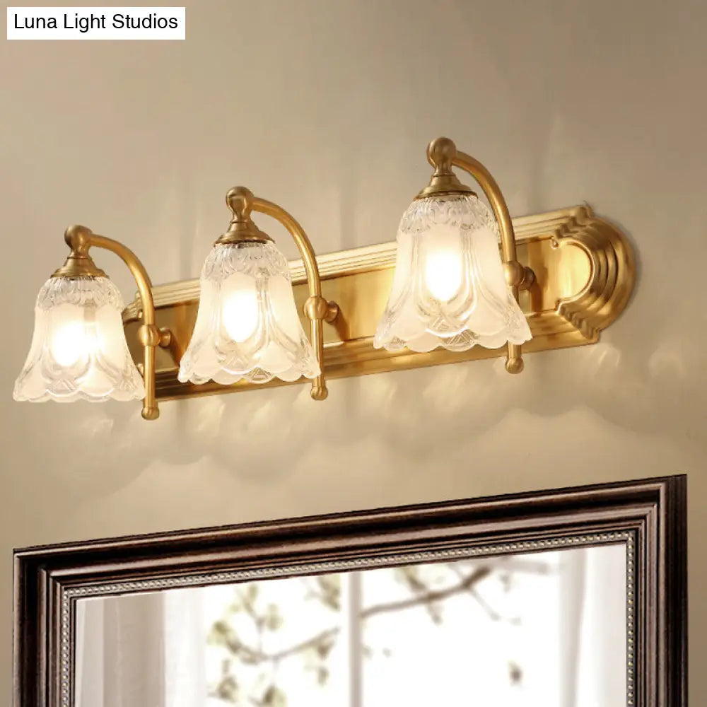 Brass Armed Wall Sconce With Ribbed Glass Shade For Bathroom Decoration