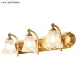 Brass Armed Wall Sconce With Ribbed Glass Shade For Bathroom Decoration