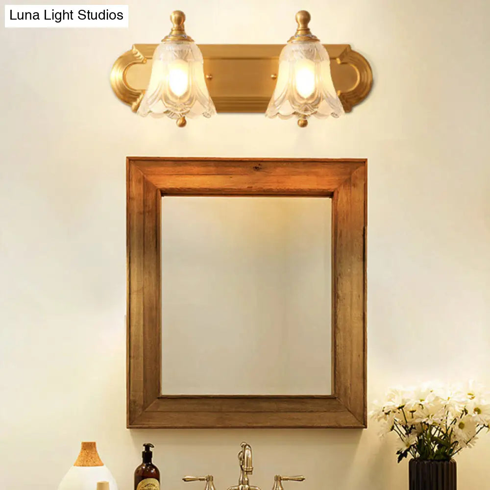 Brass Armed Wall Sconce With Ribbed Glass Shade For Bathroom Decoration