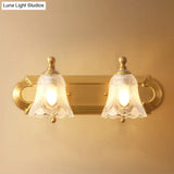 Brass Armed Wall Sconce With Ribbed Glass Shade For Bathroom Decoration