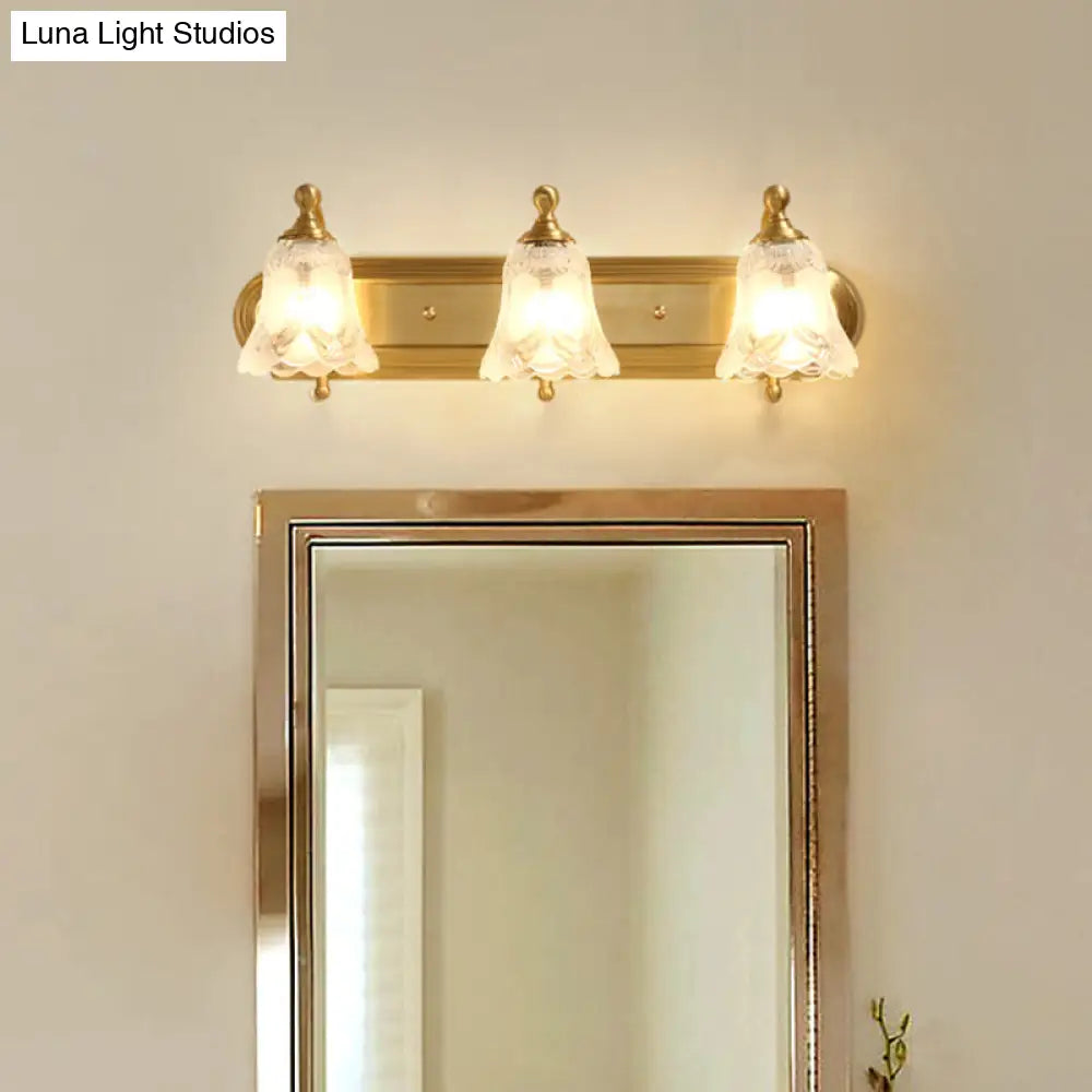 Brass Armed Wall Sconce With Ribbed Glass Shade For Bathroom Decoration