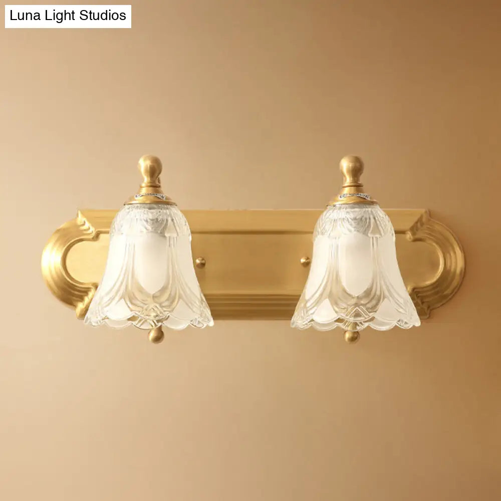 Brass Armed Wall Sconce With Ribbed Glass Shade For Bathroom Decoration