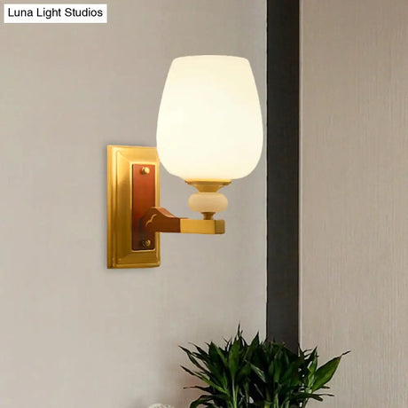 Brass Single Light Wall Mount Lamp With Opal Glass Cup Shape - Angled Lighting Idea