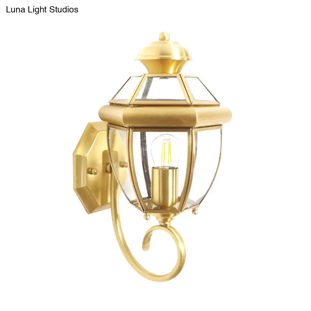 Brass Wall Sconce With Clear Glass Urn And Curved Arm Single Bulb Light Fixture