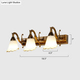 Bronze Wall Lamp With Country Flower Shade And White Rid Glass For Vanity Lighting