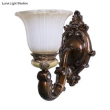Brown Antiqued Invert Bell Single Light Wall Sconce With Cream Fluted Glass