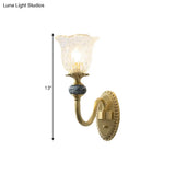 Classic Brass Floral Wall Sconce With Clear Ribbed Glass And Swooping Arm - 1/2-Head Mount Lamp