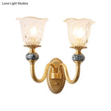 Classic Brass Floral Wall Sconce With Clear Ribbed Glass And Swooping Arm - 1/2-Head Mount Lamp