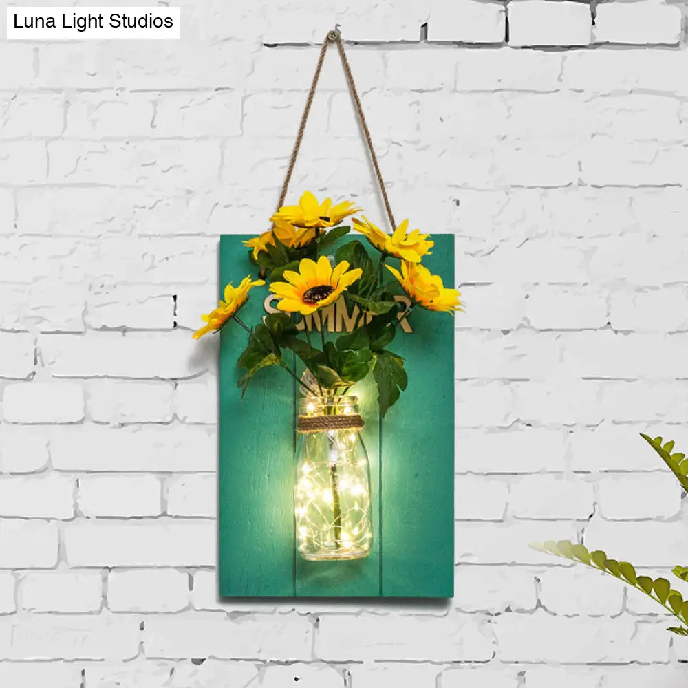Clear Bottle Wall Sconce With Led And Rustic Teal Plant Decoration