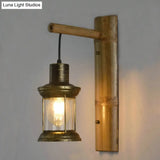 Coastal Lantern 1-Head Wall Light Sconce With Clear Glass And Bamboo Backplate