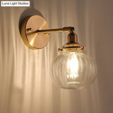 Colonial Wall Lamp With Clear/Cognac Prismatic Glass And Gold Finish