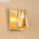 Colonial Wall Sconce: Clear Glass Cone-Shaped Light Fixture With Brass Mount For Kitchen