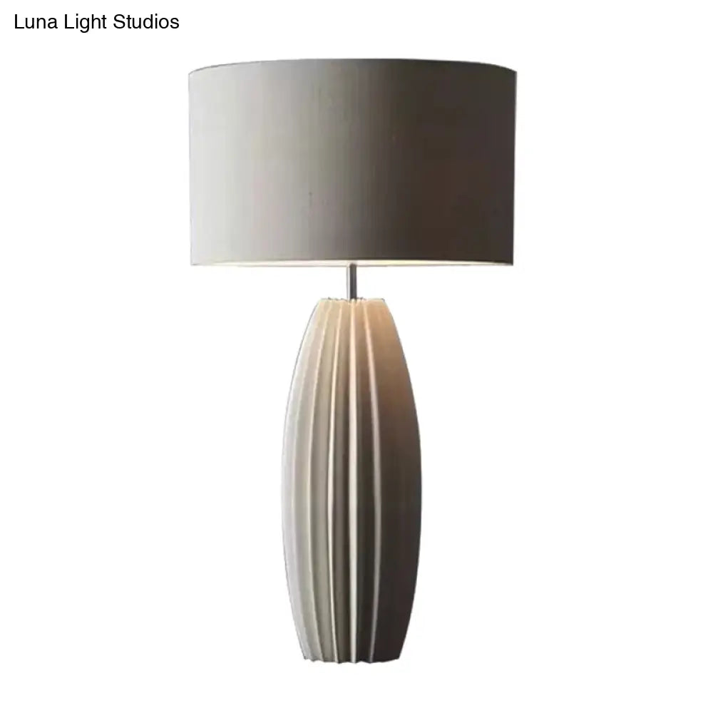 Contemporary 1-Light Ceramic Night Light With Grey Fabric Shade - Modern Drum Nightstand Lamp