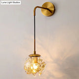 Contemporary 1-Light Clear Glass Bubble Wall Lamp With Foil Flower Decor
