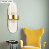 Contemporary Brass Wall Mounted Living Room Light With Clear Crystal Shade