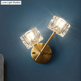 Contemporary Brass Wall Sconce With Clear Crystal Shade For Bedroom