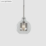 Contemporary Clear Glass Metal Pendant Light For Dining Room - 1-Light Orb Design